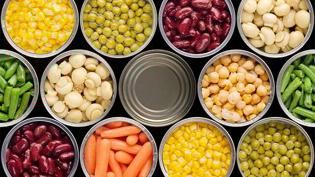 Opened cans of chickpeas green sprouts crrots corn peas beans mushrooms