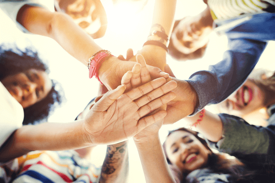 people teamwork stacking hands